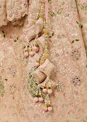 alt message - Mohey Women Golden Pink Sitara Embroidered Lehenga with Peacock Motifs image number 3
